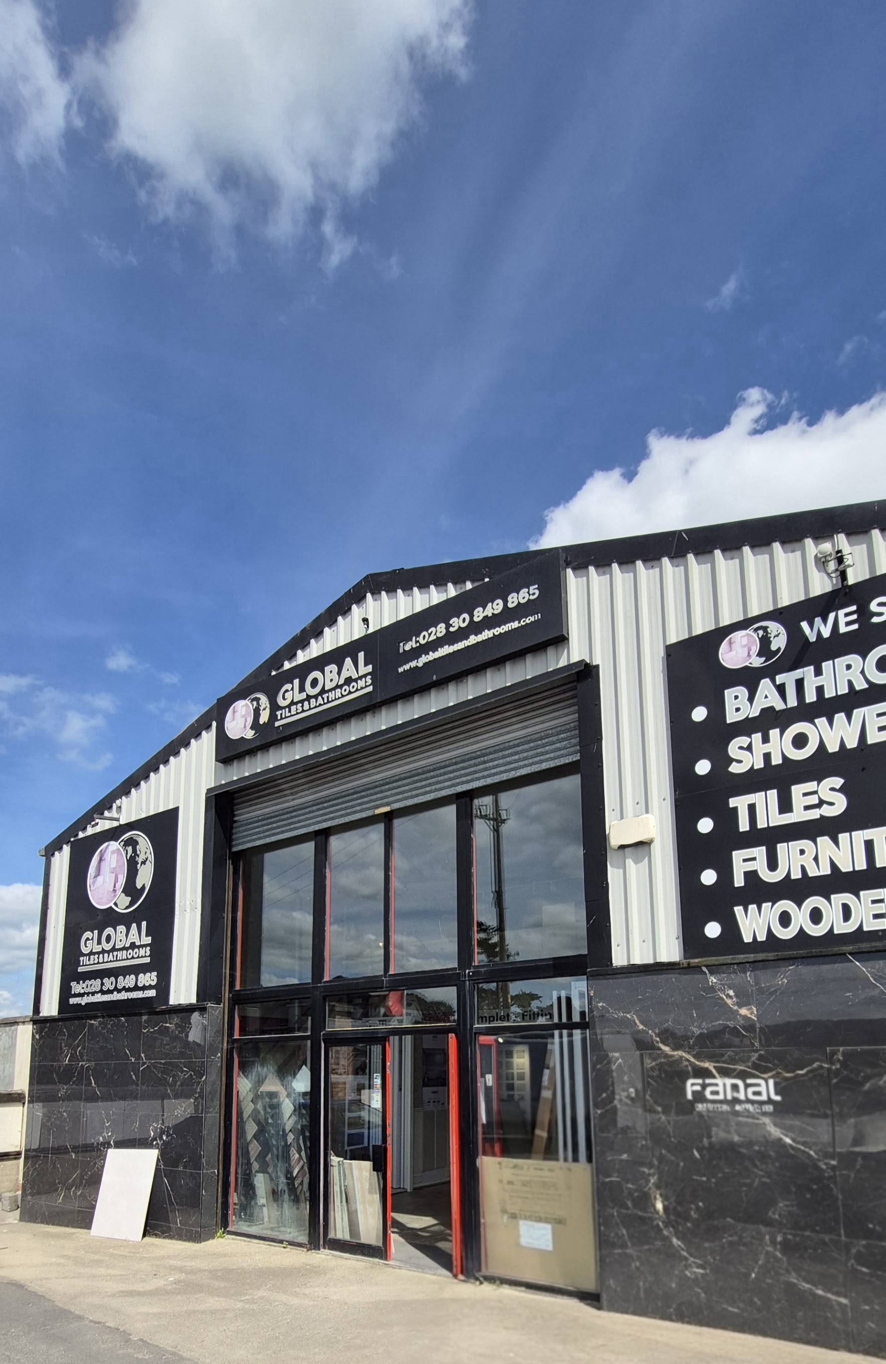 The Global Tiles & Bathrooms showroom entrance and signs at 236 Dublin Road, Newry