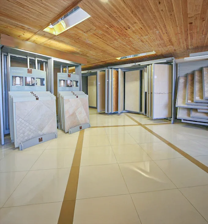 Inside the Global Tiles and Bathrooms Newry showroom, with full-size tile displays and sample stands